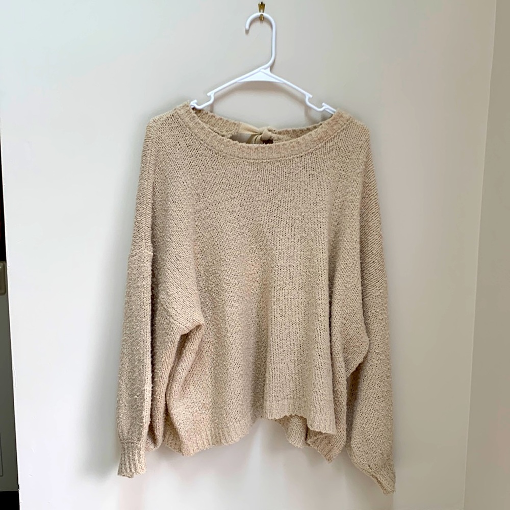 Oversized cream sweater with bow tie in back